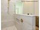 Elegant tile shower with glass enclosure, built-in bench, and designer fixtures at 1003 Idyllic Ln, Waxhaw, NC 28173