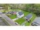Aerial view of a home with a white exterior, green lawn, and driveway at 1041 Secor St, Statesville, NC 28677