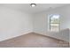 Bright room with carpet, a window, and fresh paint at 1041 Secor St, Statesville, NC 28677