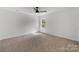 Inviting bedroom with neutral tones, carpet, and a ceiling fan at 1041 Secor St, Statesville, NC 28677
