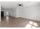 Open living space featuring hardwood floors and a modern ceiling fan at 1041 Secor St, Statesville, NC 28677