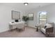 Bright home office with desk, chair, artwork, and comfortable seating area at 1041 Secor St, Statesville, NC 28677