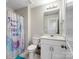 Bathroom featuring a vanity, toilet, and shower with a vibrant curtain and lighting at 1045 Cavalier Ln, Rock Hill, SC 29730