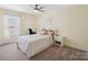 Bedroom featuring a bed, desk, and window with natural light and ceiling fan at 1045 Cavalier Ln, Rock Hill, SC 29730