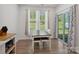 A sunlit breakfast area with windows and a sliding glass door with backyard access at 1045 Cavalier Ln, Rock Hill, SC 29730