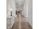 Hallway with laminate wood floors and a view of the living room and staircase at 1045 Cavalier Ln, Rock Hill, SC 29730