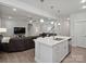 Kitchen island with sink and stainless steel dishwasher, that also looks out to the living area at 1045 Cavalier Ln, Rock Hill, SC 29730