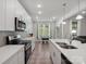 The bright kitchen features a breakfast area, stainless appliances, and white countertops at 1045 Cavalier Ln, Rock Hill, SC 29730