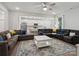 Bright, open living room with a view of the kitchen, a ceiling fan, and a plush sectional sofa at 1045 Cavalier Ln, Rock Hill, SC 29730