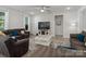 Comfortable living room featuring a sectional sofa, ceiling fan, and view of the television at 1045 Cavalier Ln, Rock Hill, SC 29730