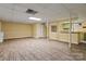 Finished basement space with light flooring and a bar-style kitchen area at 1074 Oakridge Farm Hwy, Mooresville, NC 28115