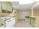 Basement kitchen featuring a stainless steel oven, bar-style countertop, and storage at 1074 Oakridge Farm Hwy, Mooresville, NC 28115