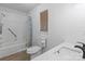 Bathroom with white tile and fixtures offers a clean and modern design at 1074 Oakridge Farm Hwy, Mooresville, NC 28115