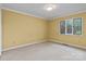 Bedroom features a window with views of the greenery outside at 1074 Oakridge Farm Hwy, Mooresville, NC 28115