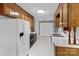 Bright kitchen with ample cabinet space and white appliances providing a functional and appealing space at 1074 Oakridge Farm Hwy, Mooresville, NC 28115