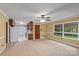 Inviting living room with large windows and a ceiling fan offering both light and comfort at 1074 Oakridge Farm Hwy, Mooresville, NC 28115