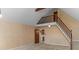 Open-concept living area with staircase leading to loft and view of kitchen at 1074 Oakridge Farm Hwy, Mooresville, NC 28115