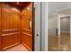 Interior view of the elevator with wood paneling and modern design at 10915 Hermit Thrush Ln, Charlotte, NC 28278