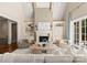 Spacious living room boasts a fireplace, built-in shelving, and ample natural light at 10915 Hermit Thrush Ln, Charlotte, NC 28278