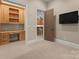 Dedicated office area with custom built-ins, desk space, and convenient media access at 10915 Hermit Thrush Ln, Charlotte, NC 28278