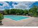 The community swimming pool is a large, inviting space surrounded by lounge chairs at 10915 Hermit Thrush Ln, Charlotte, NC 28278