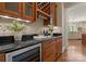 Wet bar with a wine refrigerator, custom cabinets, and granite countertop at 10915 Hermit Thrush Ln, Charlotte, NC 28278