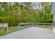 Relax and enjoy the large back deck overlooking the spacious, tree-lined backyard at 1106 University Dr, Lancaster, SC 29720