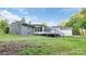 Exterior view of home featuring a screened porch and fenced-in backyard at 1106 University Dr, Lancaster, SC 29720