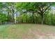 Large backyard with lush greenery, providing a private and peaceful outdoor space at 1106 University Dr, Lancaster, SC 29720