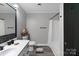 Clean bathroom featuring a modern vanity with black hardware and a tub with a shower at 1106 University Dr, Lancaster, SC 29720
