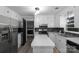 Bright kitchen with white cabinetry, stainless steel appliances, and a center island at 1106 University Dr, Lancaster, SC 29720