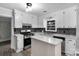 Bright kitchen featuring white cabinetry and sleek, modern appliances at 1106 University Dr, Lancaster, SC 29720