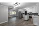 Open concept kitchen with modern appliances and island, seamlessly flowing into the dining area at 1106 University Dr, Lancaster, SC 29720