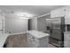 Eat-in kitchen with stainless steel appliances and access to other rooms in the home at 1106 University Dr, Lancaster, SC 29720