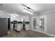 Bright kitchen with stainless steel appliances, a functional island, and elegant french doors at 1106 University Dr, Lancaster, SC 29720