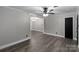 Open living room boasts neutral walls, ceiling fan, and seamless transitions to other spaces at 1106 University Dr, Lancaster, SC 29720