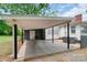 Back patio with a grilling area and a concrete pad for outdoor entertainment at 1116 Montgomery Ave, Albemarle, NC 28001