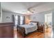 Comfortable bedroom featuring a ceiling fan, hardwood floors, and plenty of natural light at 1116 Montgomery Ave, Albemarle, NC 28001