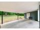 View of a covered patio, backyard, grassy area, and trees at 1116 Montgomery Ave, Albemarle, NC 28001