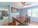 Inviting dining area featuring a wooden table, ornate chairs, and seamless access to a comfortable living room at 1116 Montgomery Ave, Albemarle, NC 28001