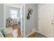 Entryway with open door, coat rack, and view to bedroom, creating a welcoming first impression at 1116 Montgomery Ave, Albemarle, NC 28001