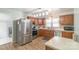 Renovated kitchen boasts stainless appliances, wood cabinets, ample counter space, and modern lighting at 1116 Montgomery Ave, Albemarle, NC 28001