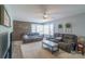 Inviting living room with comfortable seating and a decorative wood-paneled wall at 1116 Montgomery Ave, Albemarle, NC 28001