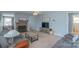 Spacious living room with a fireplace, a television, and comfortable seating, seamlessly connecting to other living spaces at 1116 Montgomery Ave, Albemarle, NC 28001