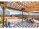 Serene backyard patio with a pergola, string lights, and a lush garden at 1124 Culver Spring Way, Charlotte, NC 28215