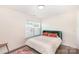 Sunlit bedroom features a comfortable queen bed, stylish decor, and a large window at 1124 Culver Spring Way, Charlotte, NC 28215