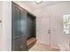 Stylish entryway with built-in storage and bench seating, offering a practical and welcoming space at 1124 Culver Spring Way, Charlotte, NC 28215