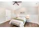 Main bedroom with a ceiling fan, wainscotting, and neutral paint at 1124 Culver Spring Way, Charlotte, NC 28215