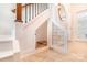Staircase with storage space underneath, complete with door and neutral tile flooring at 1124 Culver Spring Way, Charlotte, NC 28215