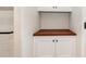 Bathroom featuring storage with wood countertop and white cabinets at 1124 Culver Spring Way, Charlotte, NC 28215